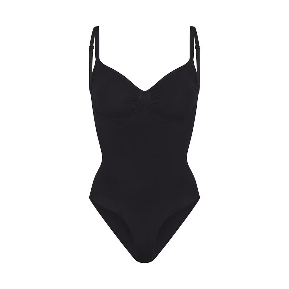 Skims Kardashian with the same sexy non-marking one-piece shapewear waist belly triangle hip thong